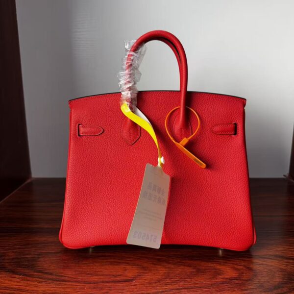 Birkin 25 Handcrafted Togo Leather in Ferrari Red with Silver Hardware Hand stitched Saddle stitch authentic hand-sewn sophisticated 2 Birkin 25 Handcrafted Togo Leather in Ferrari Red with Silver Hardware Hand stitched Saddle stitch authentic hand-sewn sophisticated