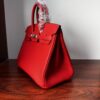 Birkin 25 Handcrafted Togo Leather in Ferrari Red with Silver Hardware Hand stitched Saddle stitch authentic hand-sewn sophisticated 13 Birkin 25 Handcrafted Togo Leather in Ferrari Red with Silver Hardware Hand stitched Saddle stitch authentic hand-sewn sophisticated